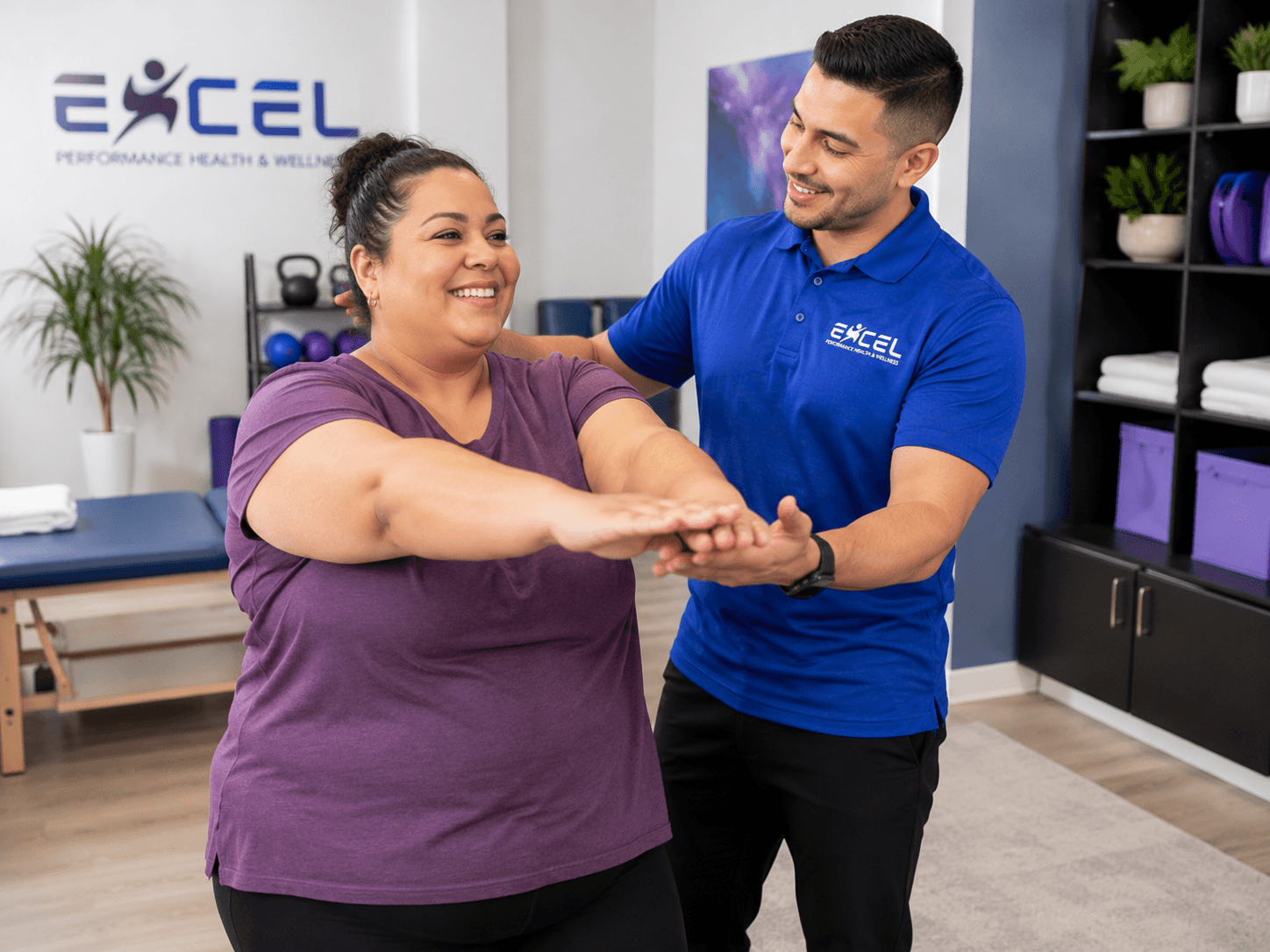 Therapist guiding a patient through a functional squat movement